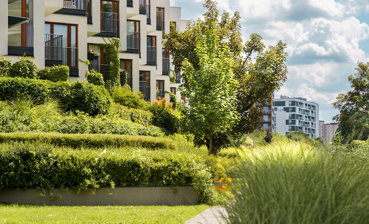 Crafting Captivating Headlines: Your awesome post title goes here Elegant modern residential complex with lush gardens and urban landscape views.